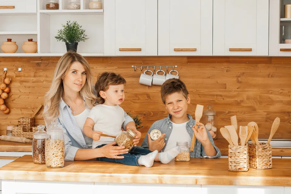 Leena cooking with her two children, capturing the spirit of sharing, love, and family traditions in the kitchen.